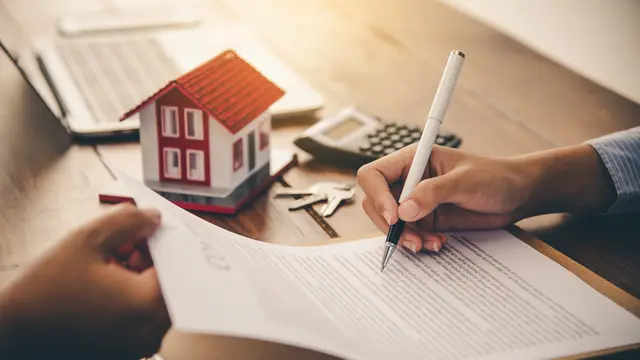 A person signing a contract