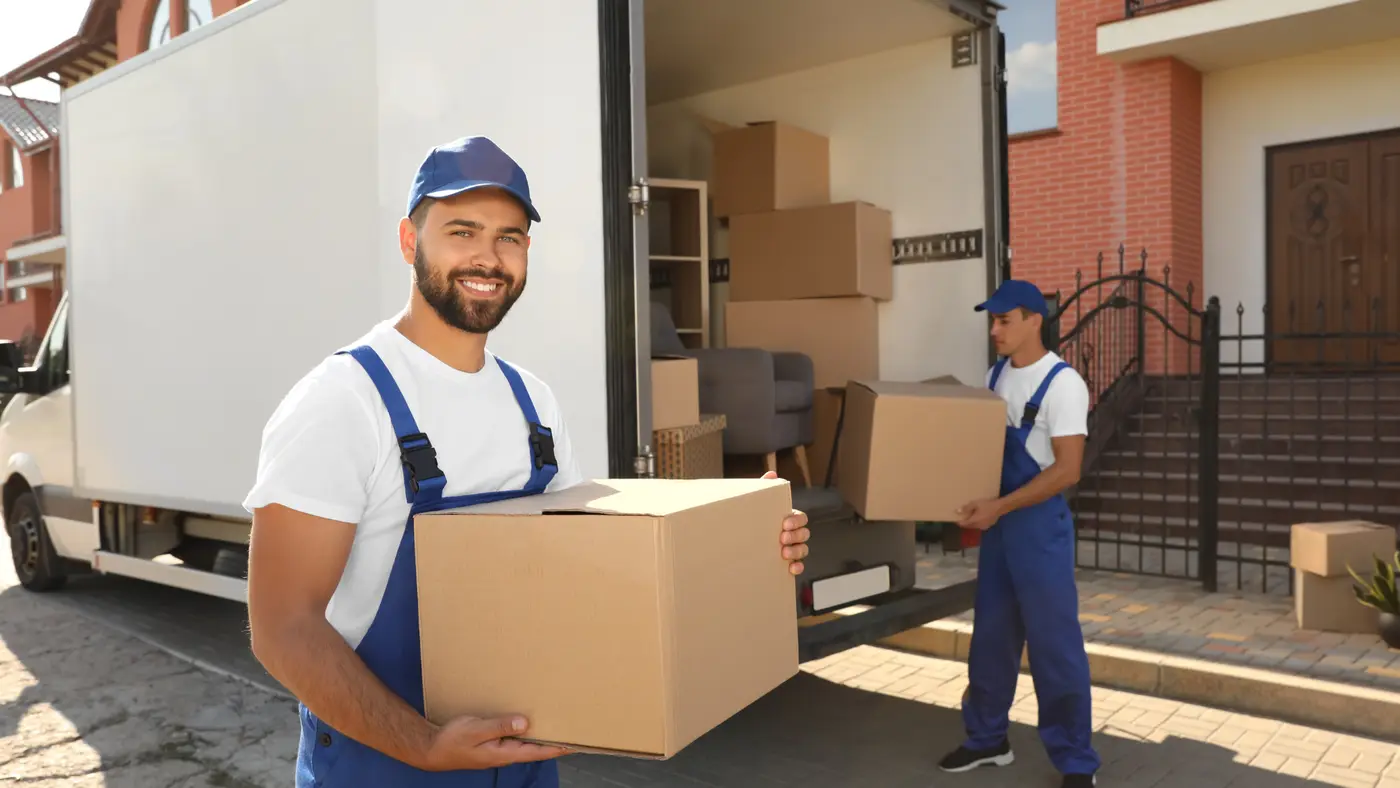 Two Men Happily Moving Boxes