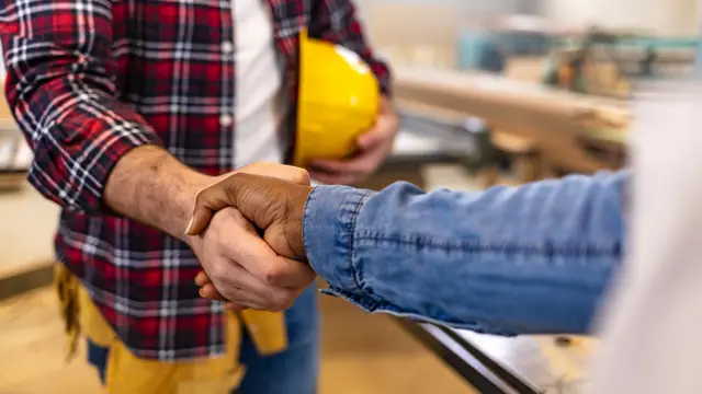 Two Contractors Hand Shaking